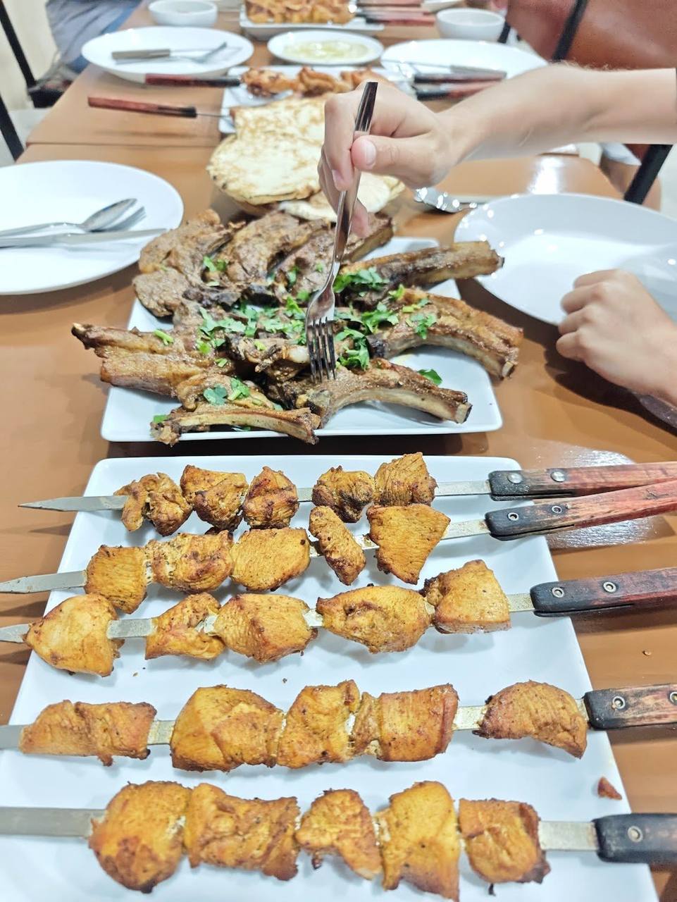 A mix of grilled BBQ meats on the table
